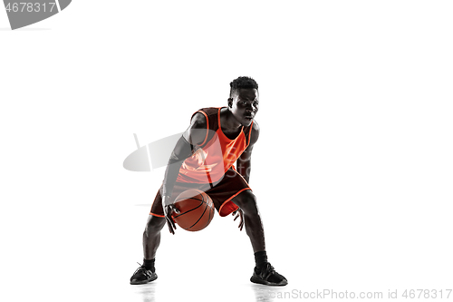 Image of Full length portrait of a basketball player with ball