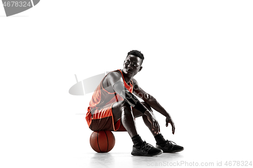 Image of Full length portrait of a basketball player with ball