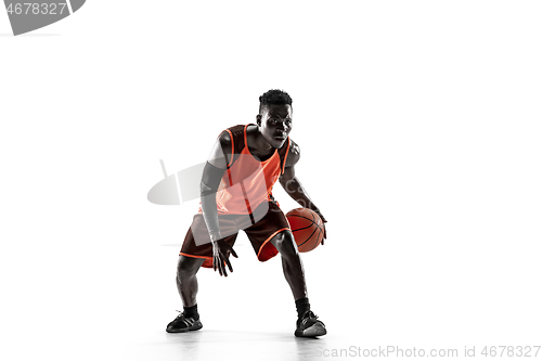 Image of Full length portrait of a basketball player with ball