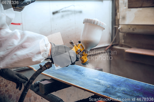 Image of Master painter in a factory