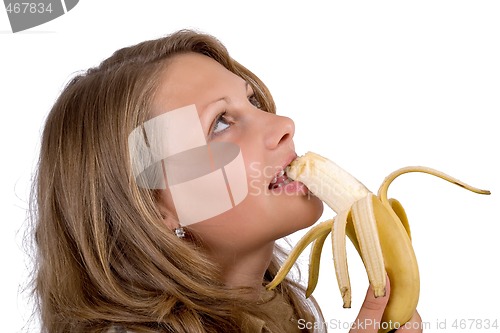 Image of Portrait of the young woman with a banana. Isolated