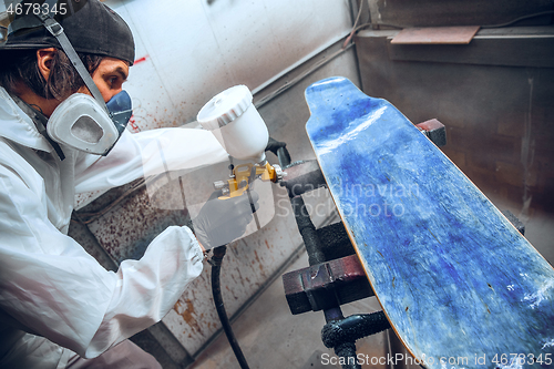 Image of Master painter in a factory