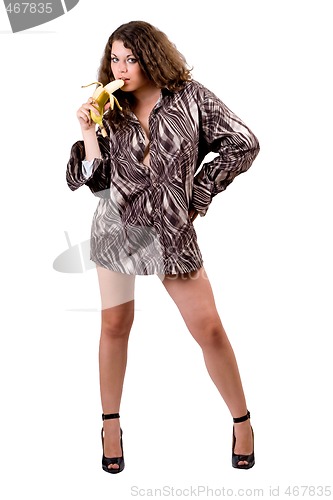 Image of young sexy beauty woman in a man's shirt with a banana. Isolated