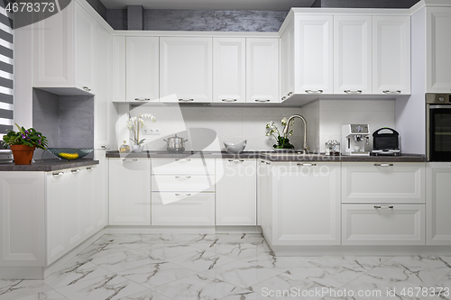 Image of Clean and minimalistic modern white kitchen interior