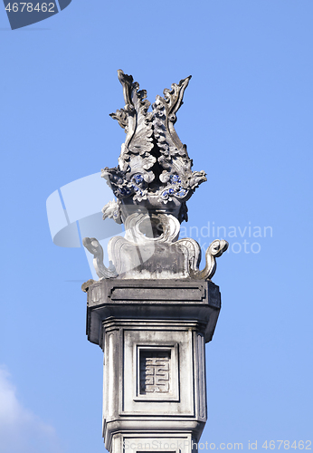 Image of Decorative detail on a column in a Vietnamese temple