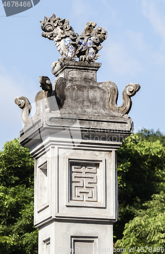 Image of Decorative detail on a column in a Vietnamese temple