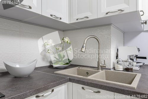 Image of Closeup of minimalistic white kitchen furniture