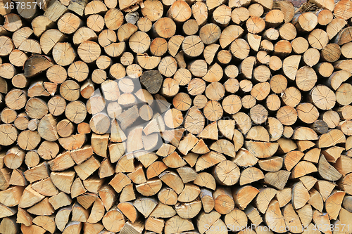 Image of Firewood pile stacked chopped wood trunks