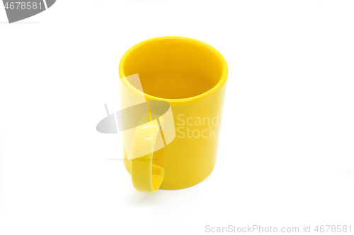 Image of Bright yellow ceramic cup on white background