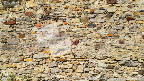 Image of Ancient wall with stones, cobblestones and bricks