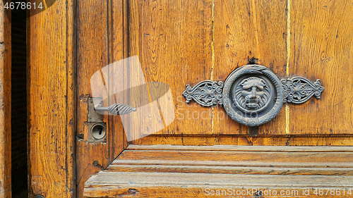 Image of Vintage door with handle, keyhole and decorative lion head and s