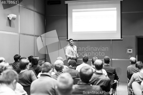 Image of Business speaker giving a talk at business conference meeting event.