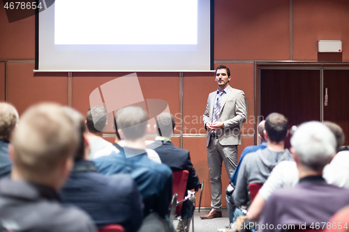 Image of Business speaker giving a talk at business conference meeting event.