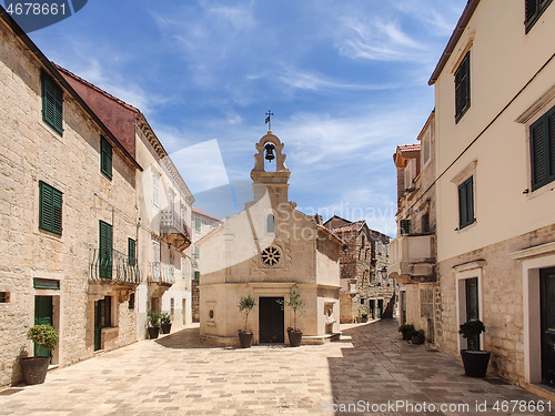 Image of Small church on square of small urban village of Stari grad on Hvar island in Croatia, Adriatic Sea, Europe.