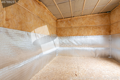 Image of Combination of insulation during the construction of a house, a heat-insulating layer of reflective foamed polyethylene laminated with lavsan when insulating a house