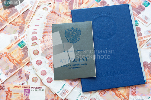 Image of A certificate and a diploma are on the five thousandth Russian rubles
