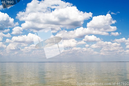 Image of The blue sky and clouds over a sea bay