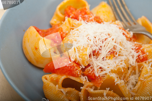 Image of Italian snail lumaconi pasta with tomatoes