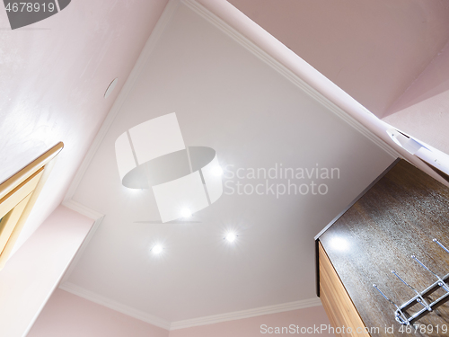 Image of Stretch matte white ceiling in the interior of a small hallway in a small apartment