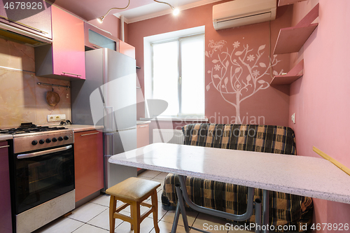 Image of Kitchen table and sofa in the interior of the kitchen