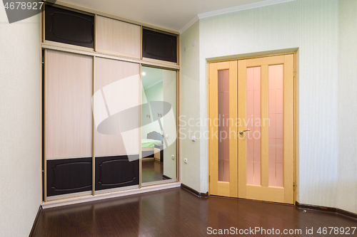 Image of Fragment of the bedroom interior, view of the wardrobe and the interior door