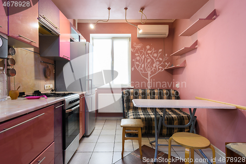 Image of Interesting kitchen in a small studio apartment