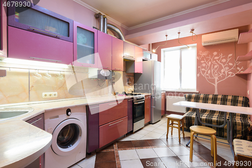 Image of Interior of a modern kitchen in an apartment of a multi-storey building