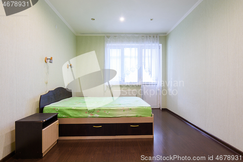 Image of General view of an empty bedroom in a one-room apartment