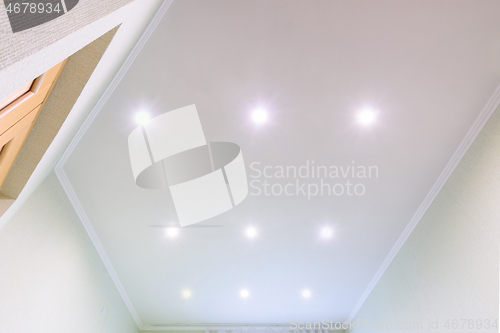 Image of White beautiful matte stretch ceiling in the interior of the hall