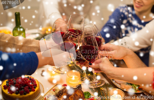 Image of close up of friends with wine celebrate christmas