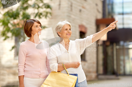 Image of senior women with shopping bags in tallinn city