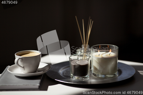 Image of coffee, candles and aroma reed diffuser on table