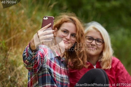 Image of Girls making faces for selfie