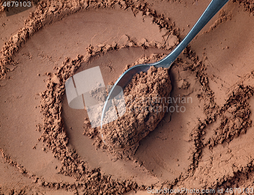 Image of spoon of cocoa powder
