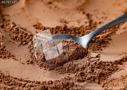 Image of spoon of cocoa powder