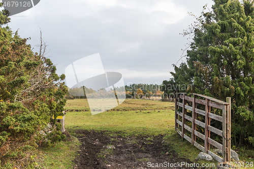 Image of Open gate into a fall colored landscape