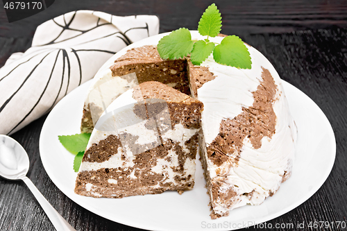 Image of Dessert of curd and chocolate a plate on wooden board