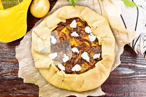 Image of Pie with pumpkin and onions on parchment top