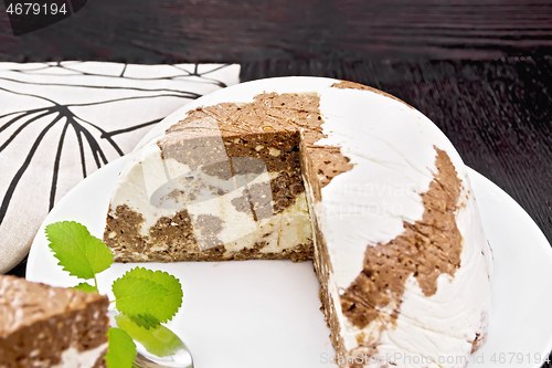 Image of Dessert of curd and chocolate a plate on dark board