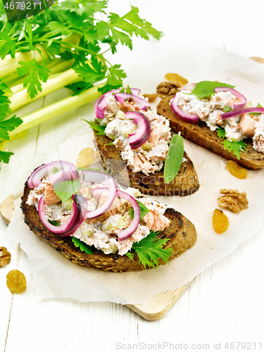 Image of Bruschetta with fish and curd on white board