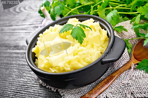 Image of Potatoes mashed in saucepan on black board