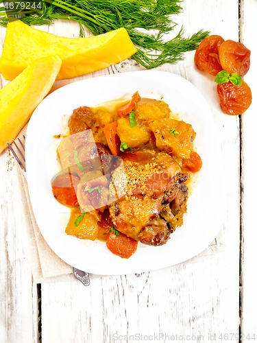 Image of Chicken roast with pumpkin and dried apricots on board top