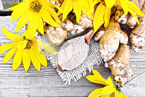 Image of Flour of Jerusalem artichoke in spoon on old board top