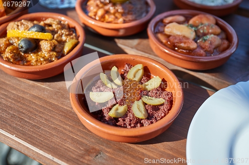 Image of Tapas served in many small plates