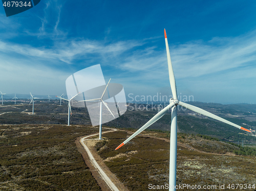 Image of Windmills or wind turbine on wind farm