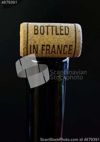 Image of bottleneck and cork with inscription Bottled in France 