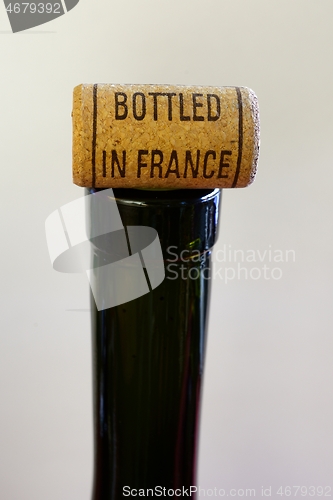 Image of bottleneck and cork with inscription Bottled in France 