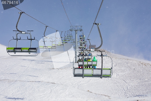 Image of Ski lift in falling snow