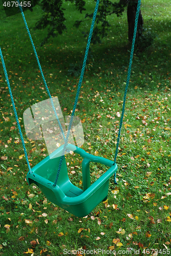 Image of plastic swing on a rope