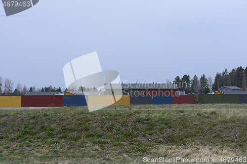 Image of fenced residential area, deadpan photo